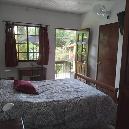 Bedroom; queen-size bed, desk with personal WiFi router, access to the bathroom and the te